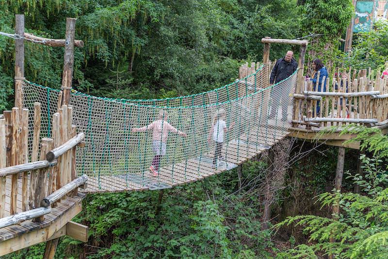 Walking over the rope bridge at Brodick Castle Isle Be Wild Adventure Play Arran