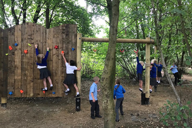 The kids playing on the new adventure play at Poringland School lead image